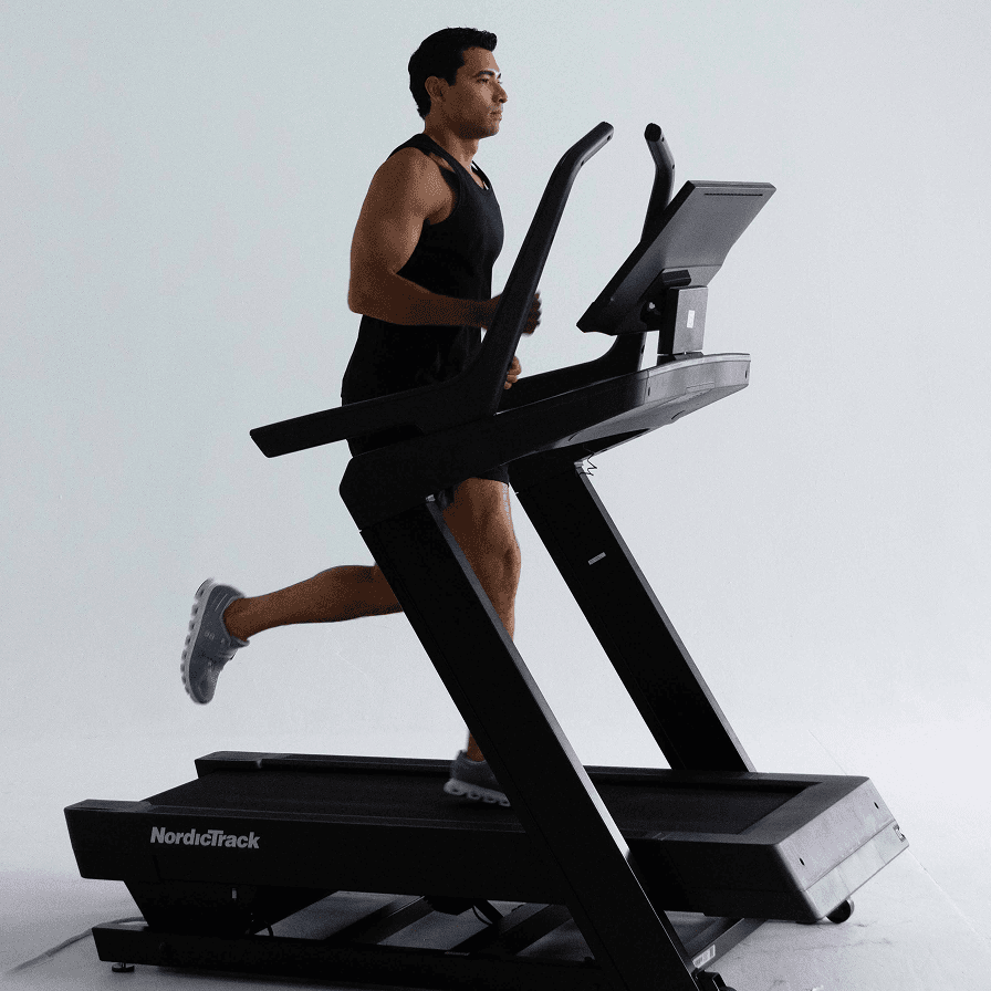 Man running on a NordicTrack treadmill during a cardio workout built by Tailor in the iFIT Personal Trainer app