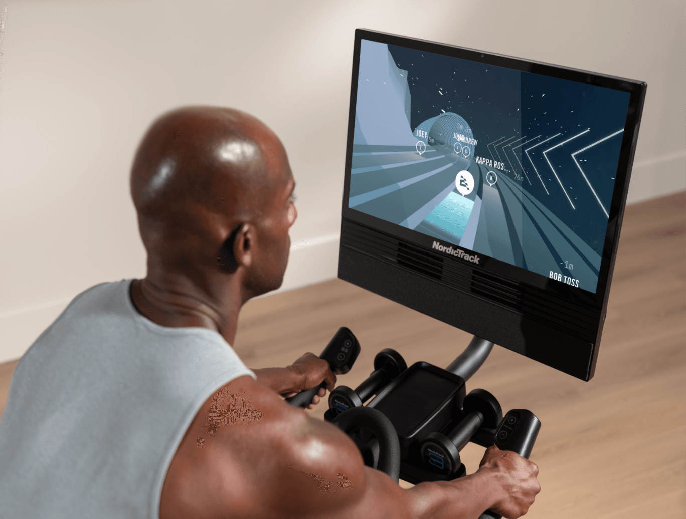 iFIT Spring Cup athlete training on a NordicTrack exercise bike with immersive, connected workout experience.