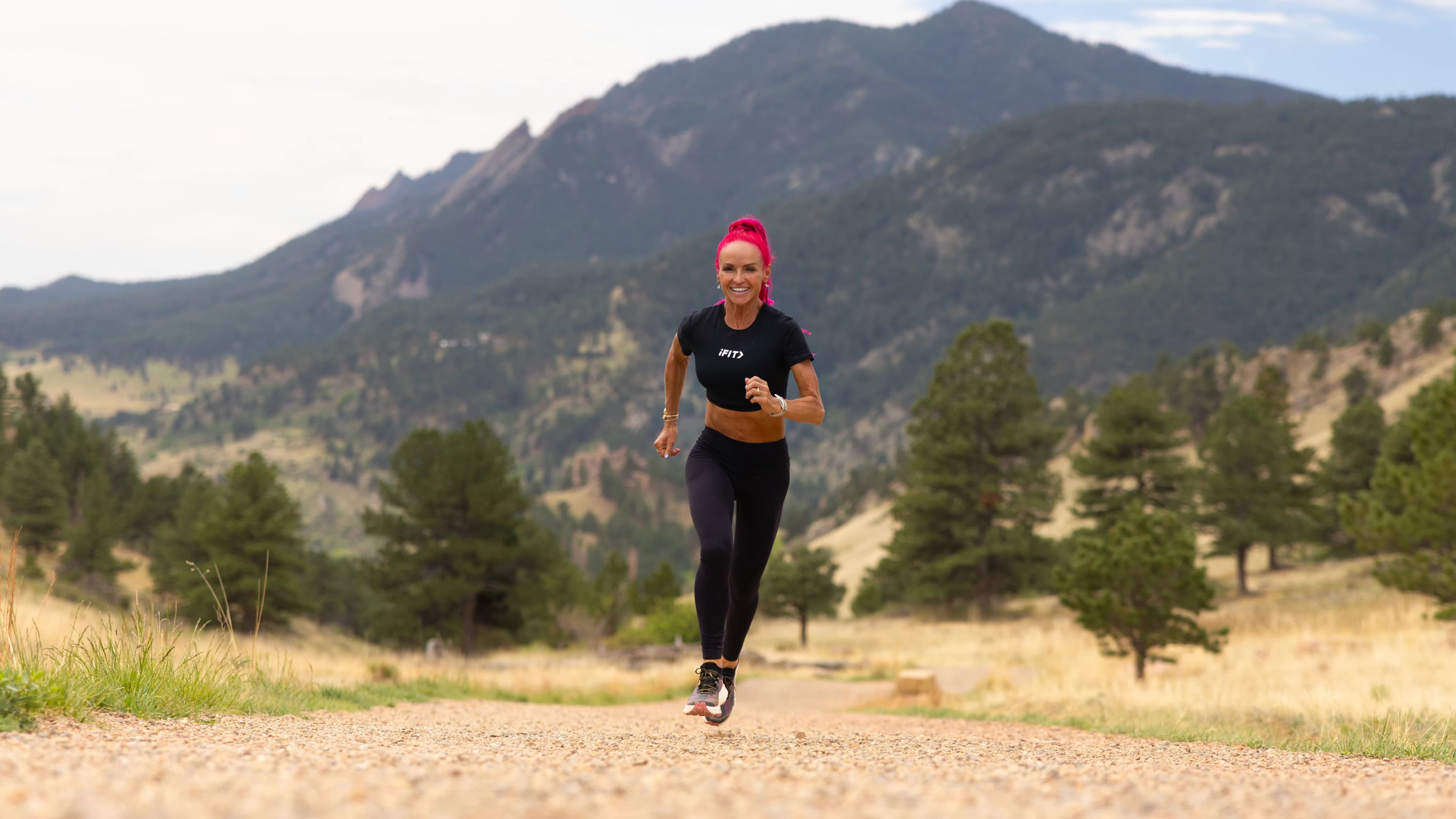 iFIT Trainer Ashley Paulson trains on a mountain trail, building the aerobic base covered in this guide to her training philosophy.